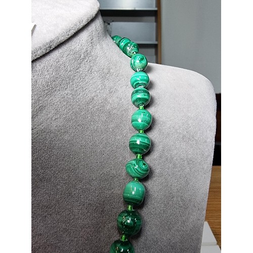 203 - An impressive Malachite beaded necklace with a graduating design, the malachite beads present an exc... 