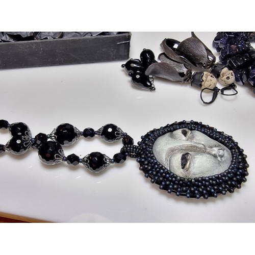 207 - A large collection of unusual gothic jewellery to include an unusual black crystal necklace with a c... 