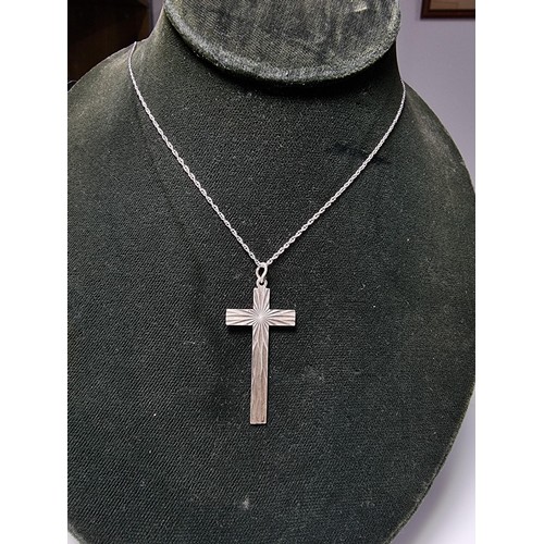 208 - A 925 silver Cross pendant with an engraved design on an 18