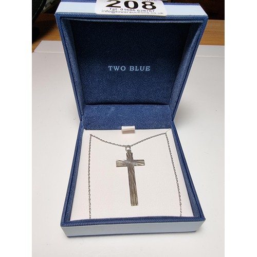 208 - A 925 silver Cross pendant with an engraved design on an 18