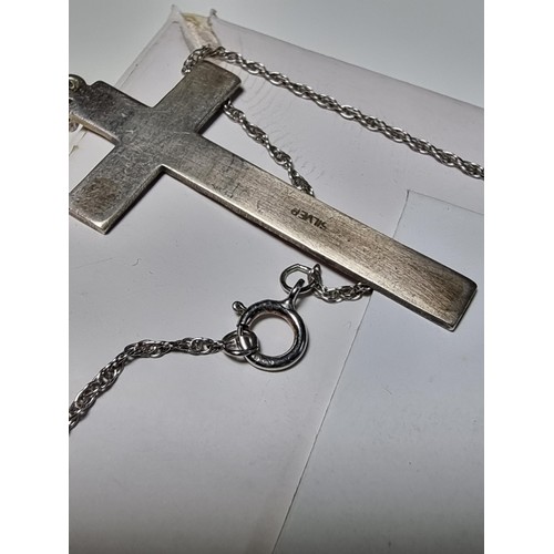 208 - A 925 silver Cross pendant with an engraved design on an 18