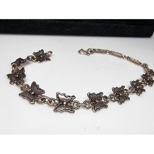 209 - A pretty 925 silver butterfly formed panel bracelet in excellent clean condition, boxed. Length of 7... 