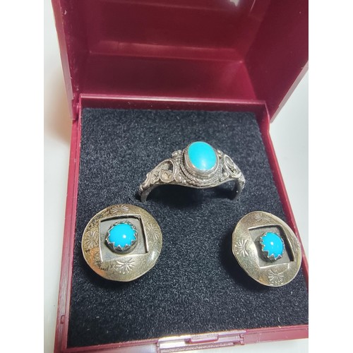 212 - A matching 925 silver jewellery set to include a pair of stud earrings inset with turquoise stones a... 