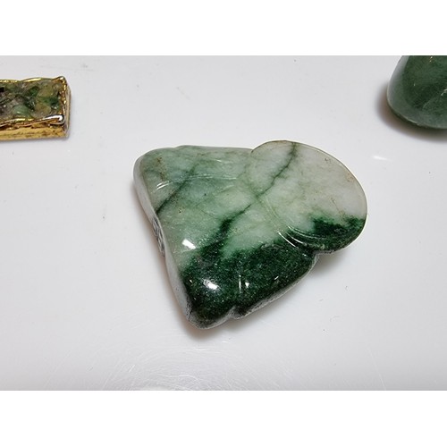 215 - A large collection of genuine jade items to include a well carved jade buddha figure, a jade heart p... 