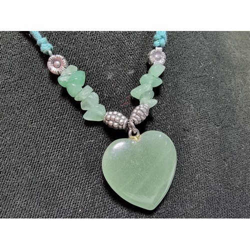 215 - A large collection of genuine jade items to include a well carved jade buddha figure, a jade heart p... 