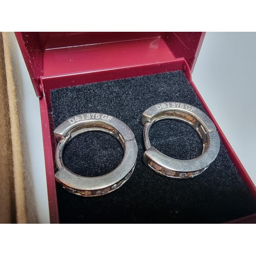 216 - A pair of 9ct white gold filled hoop earrings with CZ crystal stones along with a 21st birthday 925 ... 