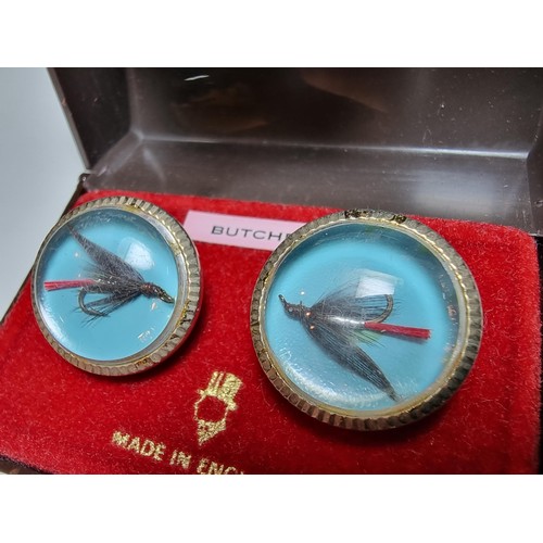 217 - A pair of vintage gilt cufflinks both inset with a genuine fishing fly, cased and ideal for a fisher... 