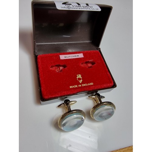 217 - A pair of vintage gilt cufflinks both inset with a genuine fishing fly, cased and ideal for a fisher... 