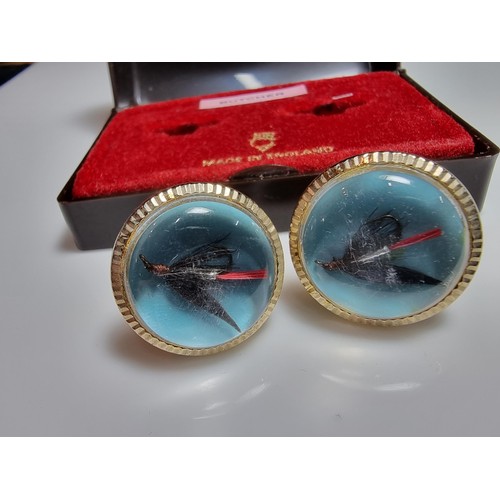 217 - A pair of vintage gilt cufflinks both inset with a genuine fishing fly, cased and ideal for a fisher... 