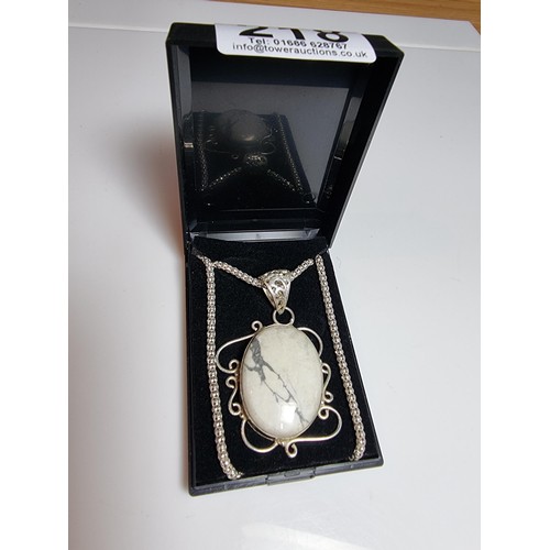 218 - A good quality 925 silver large pendant inset with a large oval white Howlite stone set on a very go... 