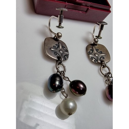 222 - A pair of 925 silver screw back drop earrings inset with 3 genuine pearls on each, in excellent clea... 