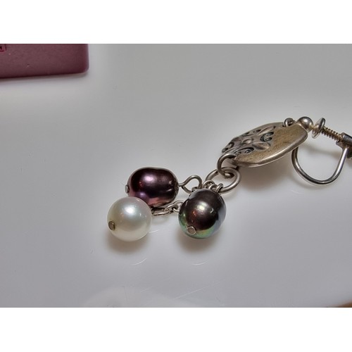 222 - A pair of 925 silver screw back drop earrings inset with 3 genuine pearls on each, in excellent clea... 