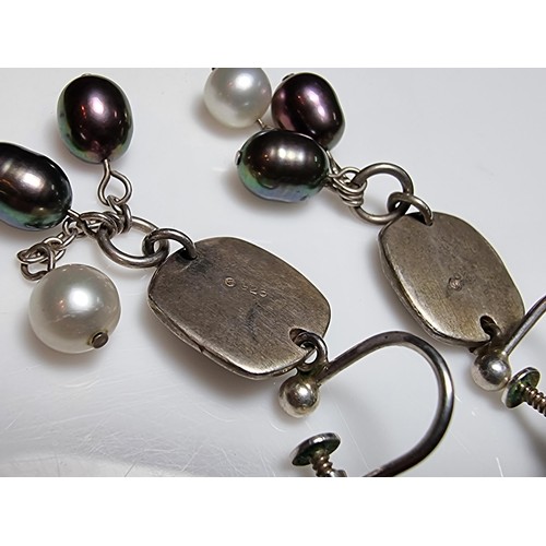 222 - A pair of 925 silver screw back drop earrings inset with 3 genuine pearls on each, in excellent clea... 