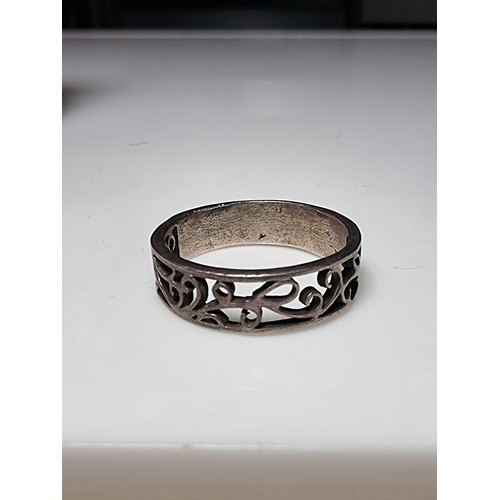 223 - A 925 silver ring with an ornate pierced design, in good clean condition and boxed, size Q.