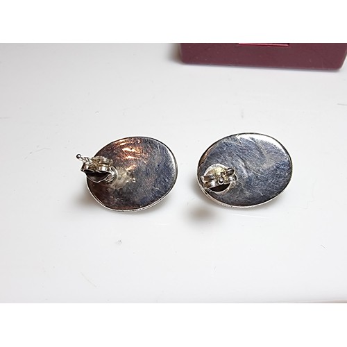 224 - A pair of pretty 925 silver stud earrings inset with stunning spectrolite stones with excellent flas... 