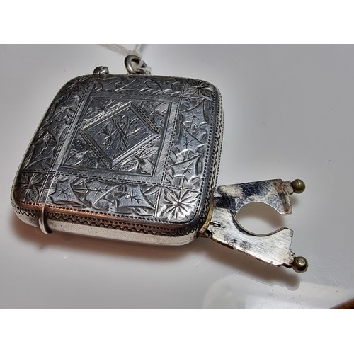 231 - A good quality antique hallmarked silver vesta case with an ornate engraved design to both sides, fe... 