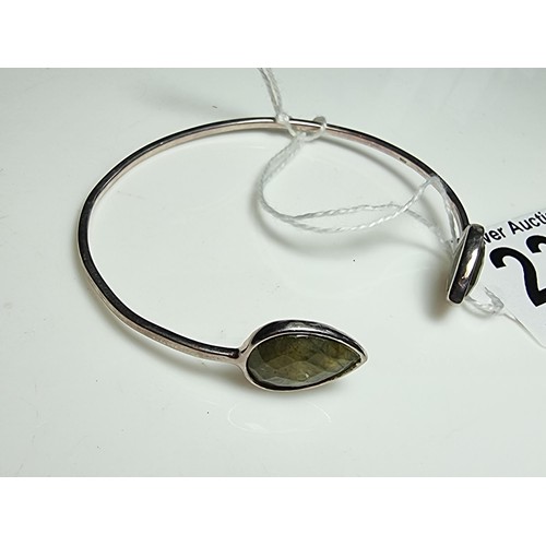 232 - A 925 silver bangle, in excellent clean condition inset with labradorite stones featuring colour fla... 