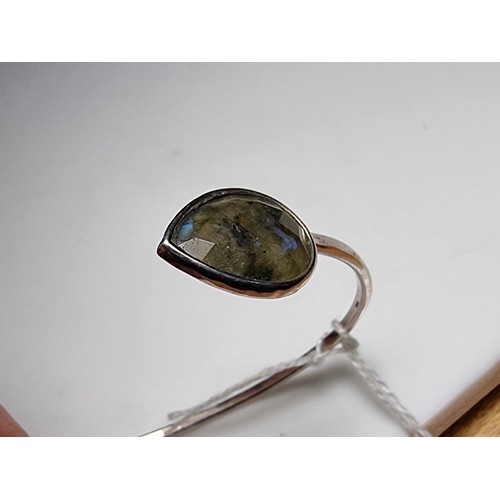 232 - A 925 silver bangle, in excellent clean condition inset with labradorite stones featuring colour fla... 