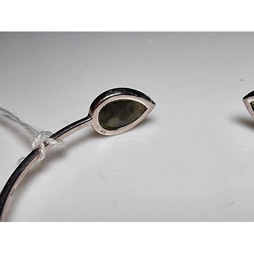 232 - A 925 silver bangle, in excellent clean condition inset with labradorite stones featuring colour fla... 