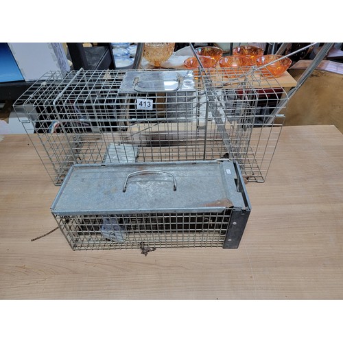 413 - 2x humane animal traps, largest trap measures 29cm high, 67cm cm long 24cm wide