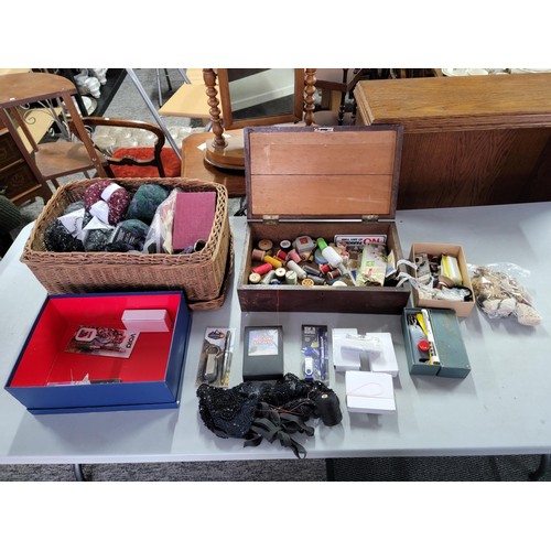 431 - Large quantity of sewing accessories in one wooden box and a wicker basket inc a large quantity of w... 