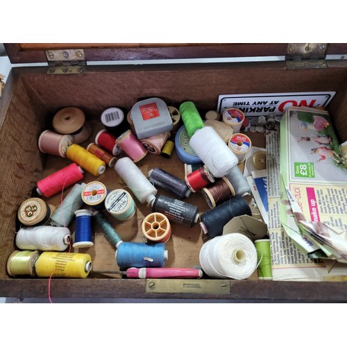 431 - Large quantity of sewing accessories in one wooden box and a wicker basket inc a large quantity of w... 