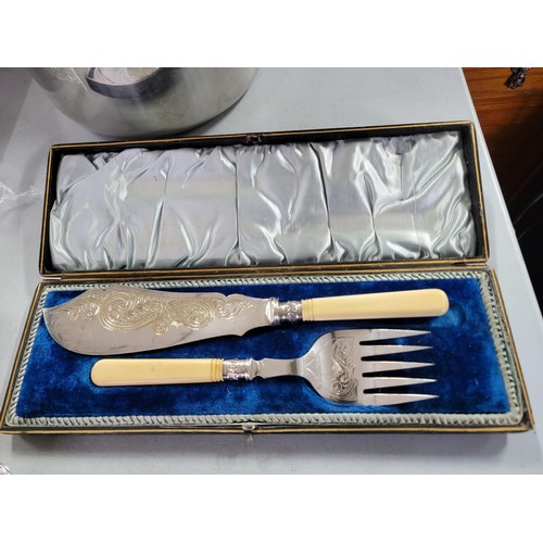 432 - Quantity of cutlery inc a silver plated cased serving set, tray of cutlery and a large jam pan with ... 