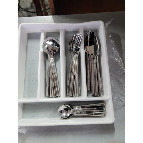 432 - Quantity of cutlery inc a silver plated cased serving set, tray of cutlery and a large jam pan with ... 