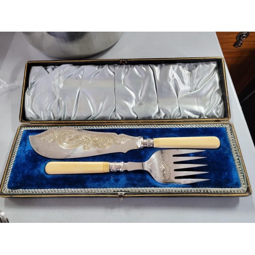 432 - Quantity of cutlery inc a silver plated cased serving set, tray of cutlery and a large jam pan with ... 