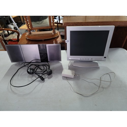 434 - MOGEN TV Monitor along with a Panasonic Sc-HC397 DVD / Radio player both with power cables