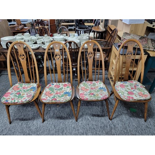 Set of 4 Ercol spindle back dining chairs with carved swan in