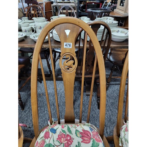 476 - Set of 4 Ercol spindle back dining chairs with carved swan in backs, with floral seat pads all in go... 