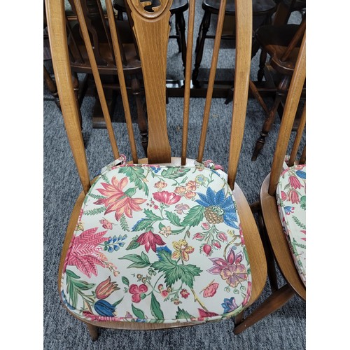 476 - Set of 4 Ercol spindle back dining chairs with carved swan in backs, with floral seat pads all in go... 