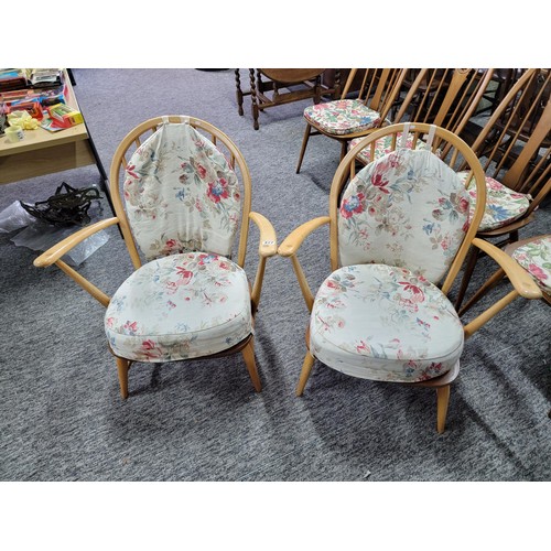 477 - Pair of Ercol low slung easy arm chairs in blonde with both seat and back pads, both in fine sturdy ... 