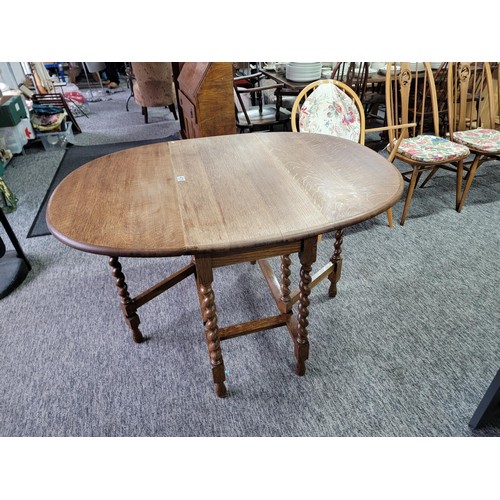 478 - Oak barley twist gate leg table giving great patina and of sturdy construction