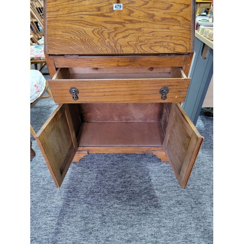 479 - Oak bureau of smaller dimensions being 98cm high 68cm wide and 27cm deep