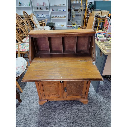 479 - Oak bureau of smaller dimensions being 98cm high 68cm wide and 27cm deep