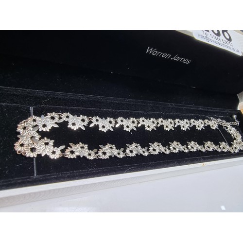 238 - A pretty 925 silver necklace with a floral design in excellent clean condition, complete with safety... 