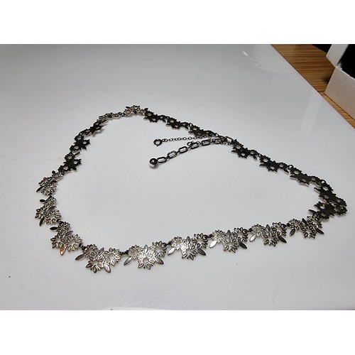 238 - A pretty 925 silver necklace with a floral design in excellent clean condition, complete with safety... 