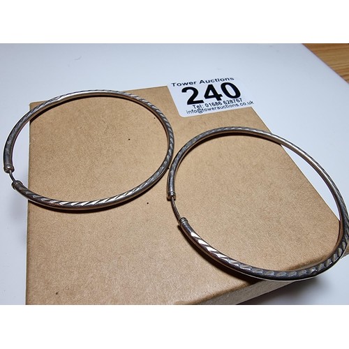 240 - A pair of good large 925 silver hoop earrings with an engraved design. In good clean condition, boxe... 