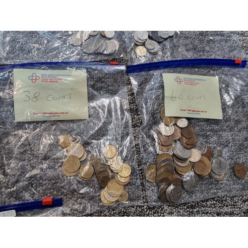 243 - A large collection of organized world coins in 17 bags all stating quantities, please study the phot... 