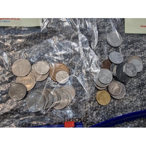 243 - A large collection of organized world coins in 17 bags all stating quantities, please study the phot... 