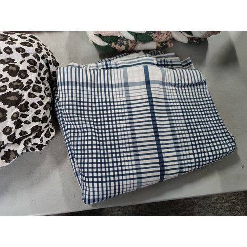 448 - Quantity of various material inc a pair of quilted cushion covers a leopard print duvet cover, blue ... 