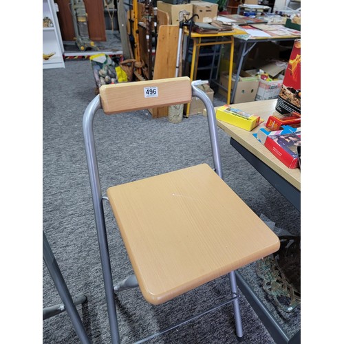 496 - 2 folding bar stools with silver coloured steel frames and solid timber seats both in good order