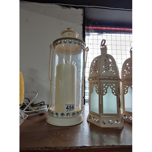 456 - A collection of 5 various lanterns, one has a jewelled rim holding a large pillar candle tallest sta... 