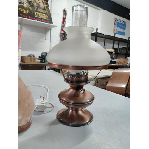 456B - Good quality brushed copper effect paraffin lamp complete with shade and chimney along with a rock c... 