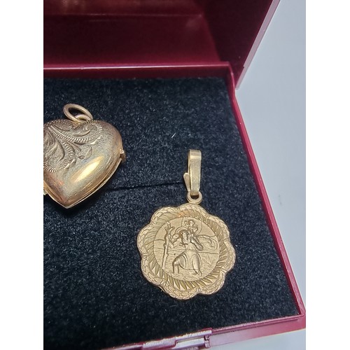 253 - 2x 9ct yellow gold hallmarked pendant to include a St Christopher pendant and a half locket pendant ... 