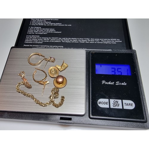 258 - A collection of scrap 9ct yellow gold with a total weight of 3.51g