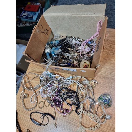 261 - A box containing a large quantity of costume jewellery along with a quantity of collectables to incl... 