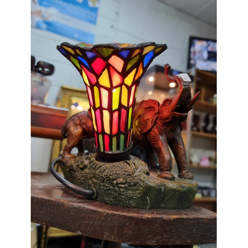 262 - A pretty resin elephant formed lamp with a stain glass shade by Widdop Bigham, signed to the rear 19... 